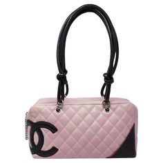 Major Y2K vibes! From 2003, in a gorgeous pink quilted leather with a large black CC logo, with silver-tone hardware and dual rolled black handles. There is a pocket on the outside and protective feet at the base. The zipper pull is a gorgeous Chanel chain that opens up to a black Jacquard Chanel logo lining with two interior pockets. The silhouette is gorgeous; the shoulder strap drops are ideal, and there is ample room for your necessities. SPECIFICS Height: 6.5" Width: 11" Depth: 4" Shoulder Channel Pink Bag, Pink Quilted Leather Bag, Chanel 2000s, Pink Chanel Bag, Chanel Bag Outfit, Y2k Handbag, 2000s Pink, Pink Items, Chanel Chain