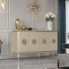 a white and gold sideboard in a living room