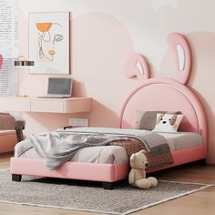 a bedroom with pink walls and furniture in the corner, including a bed frame that has ears on it