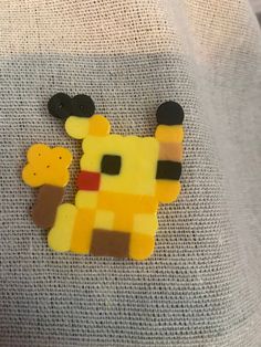 a piece of art made to look like a giraffe with a bear on it