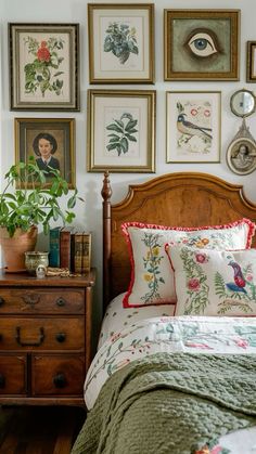 a bedroom with pictures on the wall above the bed and dresser in front of it