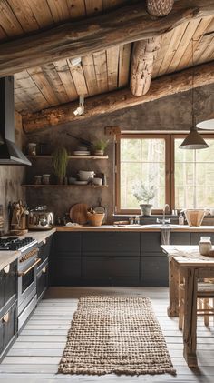 a rustic kitchen with wood floors and wooden ceilinging is seen in this image from the inside