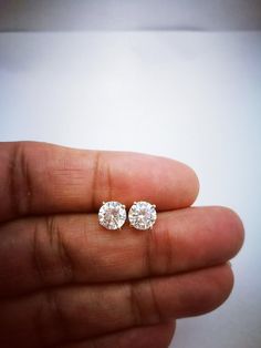 These Diamond Stimulants Stud Earrings are one of a kind. They look fabulous and beautiful when worn. This pair of Round cut or Round shape simulated diamonds is an excellent cut, Bright White D Color, and VVS1 Purity. Comes with a perfect Gift Box, Ideal for Gifting. A great Valentine's gift for Valentine's day for your Valentine's love. Ultra-luxurious and sophisticated these dramatic diamonds Stimulant earrings studs are made of sterling silver bonded with solid 14K White Gold and Rhodium. an Diamond Earrings Men, Mens Earrings, Earrings Men, Stud Earrings Women, Diamond Solitaire Earrings, Diamond Earrings Studs Round, Earrings Classic, Womens Earrings Studs, Classic Earrings