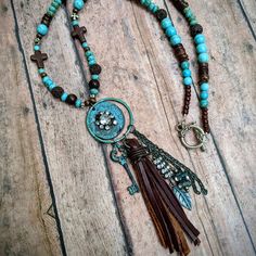 Nwt From My Craft Boutique Handcrafted Beaded Western Charm And Brown Suede Fringe Tassel Toggle Clasp Length Is 23 Inches Long Charms Add Additional 3 1/2 Inches Rustic Blue Beaded Necklaces, Rustic Blue Beaded Necklace, Bohemian Brown Necklace With Dangling Beads, Punchy Jewelry, Diy Western Jewelry, Stretch Beaded Bracelets Diy, Craft Boutique, Western Necklace, Western Necklaces