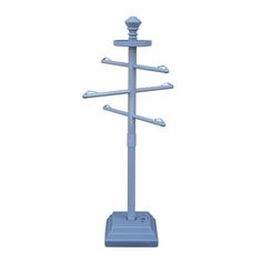 a blue coat rack with five hooks and three coats on the top, in front of a white background