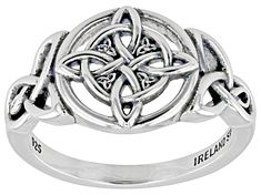 a silver ring with an intricate design on it