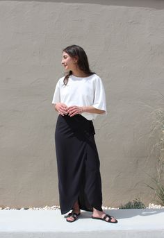 The Bobbie Maxi is a refresh of our coveted Bobbie Skirt - a stunning wrap piece met with an effortless side tie for an adjustable fit and feminine drape that can easily be worn high on the waist or lower on the hip depending on one's mood or occasion. Our sandwashed voile is lightweight and breathable, and serves a nod to a classic vintage hand and will become softer with wear. We envision pairing the Bobbie Maxi with our favorite white buttons ups and a handsome blazer. Made in USA Flowy Lined Wrap Skirt For Brunch, Chic Wrap Lined Skirt, Flowy Midi Wrap Skirt For Brunch, Chic Long Skirt With Tie Waist, Elegant Flowy Wrap Skirt For A Day Out, Chic Asymmetrical Maxi Skirt For Daywear, Flowy Lined Wrap Skirt, Asymmetrical Tie Waist Flowy Skirt, Flowy Asymmetrical Skirt With Tie Waist