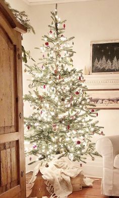 a white christmas tree in a living room