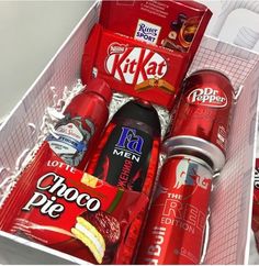 a box filled with lots of different types of snacks and drinks in it's wrapper