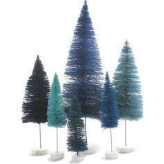 three small trees are shown in different colors