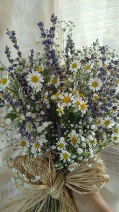 a bouquet of wildflowers tied to a burlock