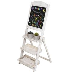 a white wooden easel with a chalkboard on it