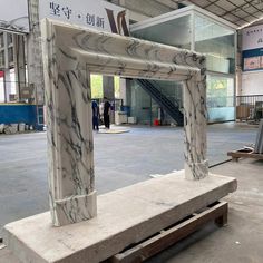 a white marble sculpture sitting inside of a building