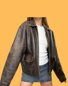 Product Overview: Step up your fashion game with this stunning vintage distressed brown leather jacket, crafted from genuine lambskin leather. Designed with an oversized fit, this retro-inspired bomber jacket brings back the 90s grunge aesthetic, making it a timeless piece for your wardrobe. Whether you're aiming for a relaxed street style look or a more rugged boho chic vibe, this leather jacket can be paired effortlessly with casual outfits. Key Features: Premium Material: Made from 100% genui 90s Style Brown Long Sleeve Outerwear, 90s Brown Long Sleeve Outerwear, Oversized Vintage Leather Jacket For Fall, Vintage Oversized Leather Jacket, 90s Grunge Fashion, Leather Jacket Oversized, 90s Grunge Aesthetic, 90s Fashion Grunge, Fashion Street Style