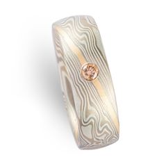 "This beautiful and unique Mokume Gane ring is shown in the Twist pattern and the Smoke metal combination. It also features a flush set diamond, a low-dome profile, and an etched finish. The Smoke palette features 14k White Gold, Palladium and Sterling Silver. This ring also has a beautiful added 14k yellow gold stratum. Palette: Smoke Pattern: Twist Width Shown: 7mm Size Shown: 9.5 Finish: Etched Profile: Low Dome Stone: 3mm cognac colored diamond Setting: Flush Add On: 14k yellow gold stratum Modern Etched Jewelry For Wedding, Mokume Gane Ring, Flush Set Diamond, Twist Pattern, Mokume Gane, Vintage Elegance, Diamond Settings, Size 10 Rings, Precious Metals