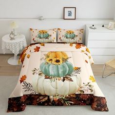 a bed with a pumpkin and flowers on it