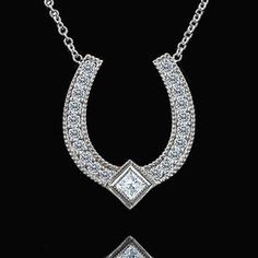 Diamond Horseshoe Necklace Lucky Pendant Good Luck Symbol Lucky Charm Gold Princess Horseshoe is widely known symbol of good luck. Designer diamond horseshoe is made of 14k white gold and is 16mm tall (6/10inch) 13mm (5/10inch) wide. Pendant comes with 14K white gold chain (16 or 18 inch length, weights approx 1.1g), weights 1.4g (without chain). Necklace contains round cut diamonds and one princess cut diamond .24cttw, SI1 - SI2 clarity, G-H color. This gold pendant was designed and created by Luxury Horseshoe-shaped Formal Jewelry, Luxury Horseshoe Jewelry For Formal Occasions, Classic Horseshoe Jewelry, White Gold Horseshoe Jewelry For Anniversary, Elegant Horseshoe Jewelry For Anniversary, Formal Horseshoe Jewelry With Diamond Accents, Elegant Silver Horseshoe Necklace, Formal Horseshoe Diamond Jewelry, Elegant Sterling Silver Horseshoe Jewelry