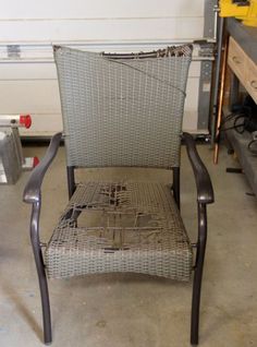 a metal chair sitting in a garage next to other tools and materials on the floor