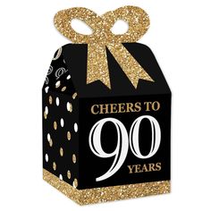 a black and gold birthday card box with a bow on top that says cheers to 80 years