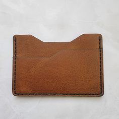 Minimalist Leather Wallet *Slim or minimalist wallet, made from hand-stitched full grain leather cowhide. *Dimensions 2.65 x 3.85 x 0.15 inches. *Please note, Wallet is natural leather and will require break-in/use to become soft and pliable. Natural leather may also have minor variations in color and blemishes. Natural leather is very durable and will last a very long time. Minimalist Leather Bifold Card Holder, Handmade Minimalist Brown Wallet, Brown Leather Everyday Card Holder, Minimalist Leather Rectangular Card Holder, Brown Minimalist Card Holder With Rfid Blocking, Minimalist Brown Card Holder, Brown Minimalist Card Holder, Minimalist Leather Rectangular Wallet, Minimalist Brown Rectangular Card Holder