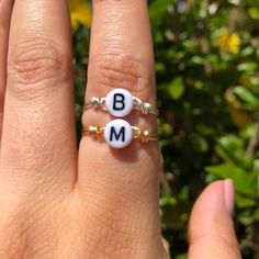 Letter ring in white and black on a wire wrapped ring. Available in gold or silver. Everyday White Hand-wrapped Jewelry, White Initial Ring As A Gift, Minimalist White Sterling Silver Initial Ring, White Sterling Silver Minimalist Initial Ring, White Initial Ring For Gift, White Initial Ring Perfect For Gift, White Rings With Initials For Gifts, Adjustable Sterling Silver Initial Ring In White, White Initials Ring