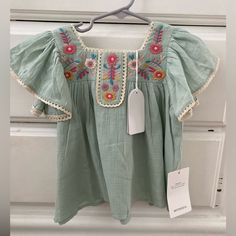 Nwt 3yr Louise Misha Yosana Blouse In Green Water 100% Cotton Similar To: Apolina Misha Puff Soor Ploom Rylee Cru House Of Paloma Multicolor Cotton Flutter Sleeve Top, Multicolor Cotton Tops With Flutter Sleeve, Playful Embroidered Short Sleeve Tops, Embroidered Summer Tops For Playtime, Summer Flutter Sleeve Tops For Playtime, Cute Green Short Sleeve Blouse, Cute Blouse For Spring Playtime, Cute Tops With Flutter Sleeves For Playtime, Cute Flutter Sleeve Tops For Playtime