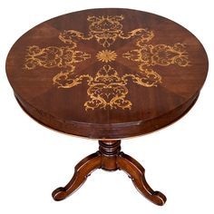 a wooden table with an intricate design on it