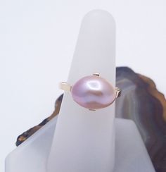 DEN1902 One of a kind baroque pearl 14k yellow gold ring. We found a dealer once with a most remarkable inventory. She had everything, matched strands, golden, Tahitian black, Akoya and a small ziplock bag containing a handful of these wonderful mauve baroque freshwater pearls. Each one was unique, the off-round qualities and the lovely depth of nacre suggesting such beautiful possibilities. This ring is the first of a line of designs using this treasure trove of special pearls. The idea in this Ziplock Bag, Ziplock Bags, Yellow Gold Ring, Baroque Pearls, Yellow Gold Rings, Gold Ring, Ring Designs, Freshwater Pearls, Statement Rings