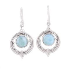 Within a ring of silver a shimmering cabochon of larimar conjures images of an ethereal full moon in this pair of dangle earrings from India. Neeru Goel expresses her childhood passion for jewelry and gemstones giving these earrings a handcrafted design from sterling silver with petite dot motifs accentuating the elegant modern appeal. Elegant Round Larimar Jewelry, Silver Larimar Dangle Earrings, Elegant Larimar Dangle Earrings, Silver Larimar Dangle Jewelry, Pink Opal Ring, Larimar Earrings, Silver Jewelry Accessories, Boho Earring, Larimar Jewelry