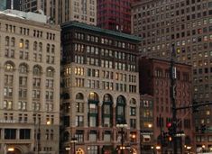 a city street filled with lots of tall buildings