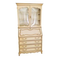 an antique china cabinet with glass doors and drawers