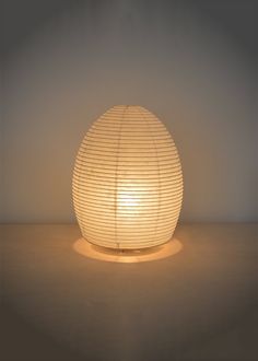 Paper moon table or floor light in an egg shape with warm ambient light. Paper Lighting, Moon Table, Japanese Washi Paper, Japanese Lantern, Simple Lamp, Paper Table, Paper Moon, How To Make Lanterns, Paper Light