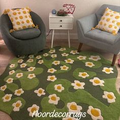 two chairs and a table in a room with flowers on the rug, one chair is blue