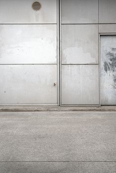 a man riding a skateboard down the side of a street