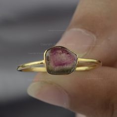 Watermelon Tourmaline Ring By Sushila Jewelry/ 14K Solid Gold Ring/ Bi Color Gemstone Ring/ Genuine Tourmaline Jewelry/ Birthday Gift Ideas NOTE: These Bío Tourmaline gemstones, sourced from natural mines, exhibit inherent variations in both color and shape. As each gemstone is unique, so we will provide you with a stone selection to choose from. ≫ Features * Items Code: SPBR00781M  * Metal: 14K Solid Gold (18K also available - Additional fees may apply) * More options in gold color: Rose gold, yellow gold, White gold * Watermelon Tourmaline Weight: 0.63 Ct  * Ring Size:- 2 to 10 ( All sizes as per your request ) ≫ FAQ below for more detail. ✦ Sizing  We can adjust most items to fit your sizing preferences. Most items can be made to any size and length. Please leave a note at checkout or c Anniversary Solitaire Tourmaline Jewelry, Anniversary Tourmaline Solitaire Jewelry, Stackable Tourmaline Jewelry For Anniversary, Yellow Gold Tourmaline Solitaire Jewelry, Round Stackable Tourmaline Jewelry, Yellow Gold Tourmaline Promise Ring, Anniversary Tourmaline Jewelry With Bezel Setting, Stackable Round Tourmaline Jewelry, Tourmaline Birthstone Ring In Yellow Gold