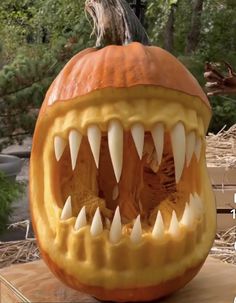 a carved pumpkin with teeth and fangs on it