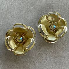 Vintage Floral Clip on earrings  Gold tone metal  Please See Pictures for size and details  Free Gift wrapping upon request Free Shipping on orders over $35 (Domestic) For more treasures please visit: https://www.GlowingEmpire.com Gold Metal Flower Earrings For Party, Vintage Gold Flower Clip-on Earrings, Metal Flower-shaped Earrings For Parties, Metal Flower Earrings For Party, Gold Clip-on Flower Shaped Jewelry, Party Jewelry With Gold Flower Decoration, Gold Flower Earrings For Party, Gold Jewelry With Flower Decoration For Parties, Gold Clip-on Flower-shaped Earrings