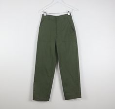 Vintage rare women's 1970s 80s us military pants Waist - 27 inches Inseam - 27.5 inches Rise - 12 inches Hips - 34 inches Cotton/Poly blend Great condition ez03 Military Style Green Cargo Pants For Workwear, Olive Military Cargo Pants, Green Military Style Straight Leg Cargo Pants, Olive Military Style Work Bottoms, Military Style Work Pants With Cargo Pockets, Military Style Olive Workwear Bottoms, Military Style Wide Leg Olive Pants, Military Style Olive Wide Leg Pants, Olive Straight Leg Military Pants