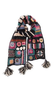 a multicolored knitted scarf with tassels