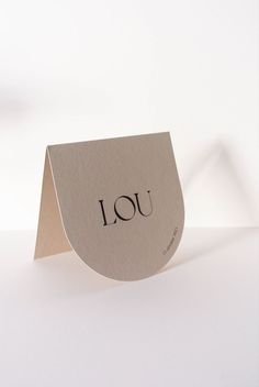 a piece of paper with the word jou on it sitting on top of a table