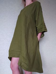 "Loose linen tunic with pockets. Great choice when you need comfortable and stylish outfit combination. You can wear it with trousers, leggings, shorts, skirts. The good thing about tunics is that you can wear them also by themselves with nothing or for example as beach cover ups. Linen tunic dress is perfect for warm days and vacation. As linen regulates body temperature, is lightweight and really absorbent, which makes it the perfect fabric for summer. ABOUT Length of this linen tunic on back Khaki Beach Dresses With Pockets, Beach Dresses With Pockets In Khaki, Green Linen Dress With Relaxed Fit For Vacation, Green Relaxed Fit Linen Beach Dress, Green Relaxed Fit Linen Dress For Vacation, Green Linen Lagenlook Dress, Green Relaxed Fit Linen Dress With Pockets, Oversized Linen Beach Dress With Pockets, Linen Tunic Dress With Pockets