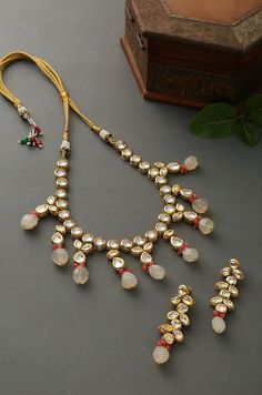 Royal Indian Kundan Necklace. This beautifully handcrafted necklace is set in silver and copper alloy and plated with 22k gold. Elegant and modern, this kundan and necklace will complete your lavish ensemble in grandeur. Necklace Size - 18 inches. Closure - Adjustable dori Earring Size: 4 cm DETAILS -100% top Quality -22K gold and silver Plated silver copper alloy. -Handcrafted in our all girls workshop in Paisley Pop Studio, Jammu and Kashmir STYLE TIP Best accessory for everything including In Silver Kundan Necklace With Gota Work For Gift, White Kundan Fusion Necklace, White Fusion Style Kundan Necklace, Festival Silver Necklace With Gota Work, White Chandbali Kundan Necklace In Fusion Style, Heavy Fusion Kundan Necklace For Festivals, Silver Kundan Necklace With Gota Work For Festivals, Fusion Style Kundan Necklace For Diwali Ceremony, Ceremonial Dual-tone Kundan Necklace