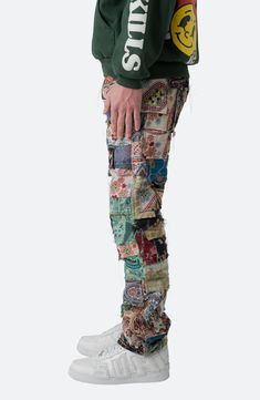 A patchwork of mixed custom jacquard woven blanket pieces creates these unique pants cut in a relaxed fit for the ultimate laid-back look. 32" inseam; 16" leg opening; 11 3/4" front rise Button fly Five-pocket style 100% polyester Machine wash, dry flat Imported Patchwork Bottoms For Streetwear, Mid-rise Streetwear Pants With Patch Pockets, Urban Patchwork Pants For Streetwear, Streetwear Patchwork Bottoms, Urban Streetwear Pants With Reflective Details, Unique Pants, Jacquard Weave, Woven Blanket, Straight Leg Pants