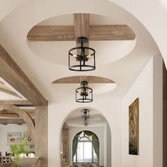 a long hallway with wooden beams and ceiling lights on either side of the hall, leading to another room