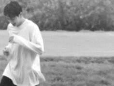 a young man is playing with a frisbee