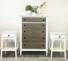 two white and brown dressers sitting next to each other on top of a rug