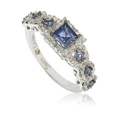 a white gold ring with blue and white diamonds