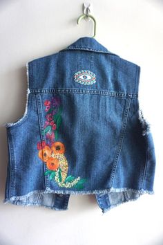 Inspired by beautiful springtime blooms.This is a thrifted Children’s Place denim vest, in a size 10/12.I hand painted the flowers on the back and added a patch to the back and brass studs to the front.All patches are reinforced by hand stitching. This item can be machine washed on gentle OR hand washed.All jackets are one of a kind.Personalization is free. Kids Jackets, Bridal Jacket, Kids Denim, Patched Jeans, Childrens Place, Denim Vest, Kids Jacket, Hand Stitching, Favorite Outfit