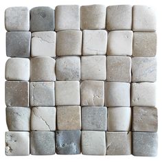 several white and gray rocks arranged in a square pattern on top of eachother