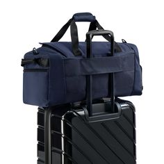 The Siege Duffle in classic navy blue has a spacious main compartment designed for multi-use. This duffle will be your go-to bag for travel, sports, and recreation, the gym, outdoor recreation, or business. The ventilated shoe compartment can double as a wet pocket to hold sweaty clothes and folds up when not in use. Using the rear strap, the bag stacks on top of your luggage, and the front organizer keeps your small essentials within reach. Functional Blue Weekender Bag For On-the-go, Blue Sporty Travel Bag For On-the-go, Versatile Blue Travel Bag, Blue Nylon Travel Bag For On-the-go, Versatile Blue Travel Bag With Luggage Sleeve, Blue Rectangular Duffle Bag For Trips, Versatile Blue Rectangular Duffle Bag, Blue Versatile Rectangular Duffle Bag, Blue Large Capacity Duffle Bag For On-the-go